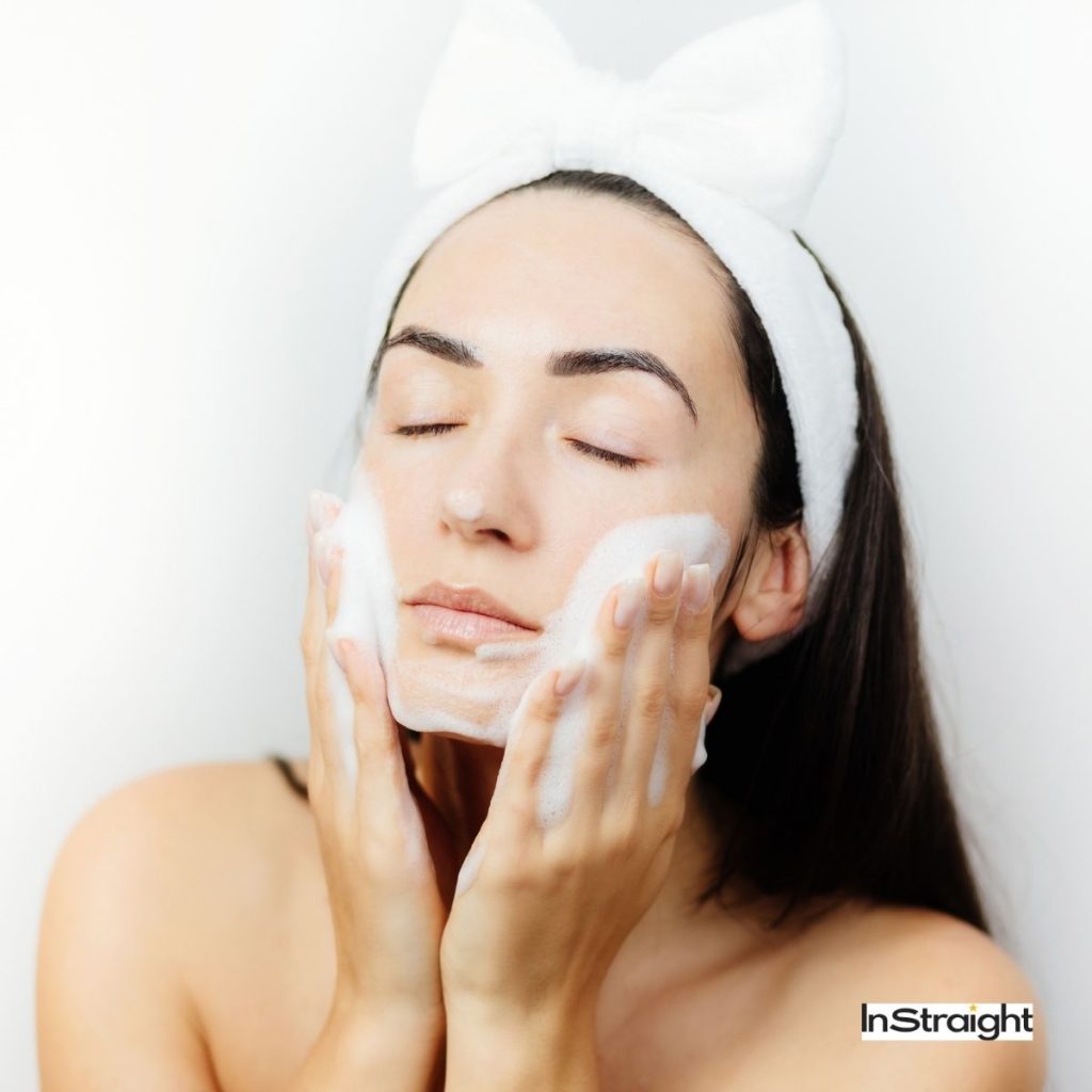 a woman using a gentle cleanser